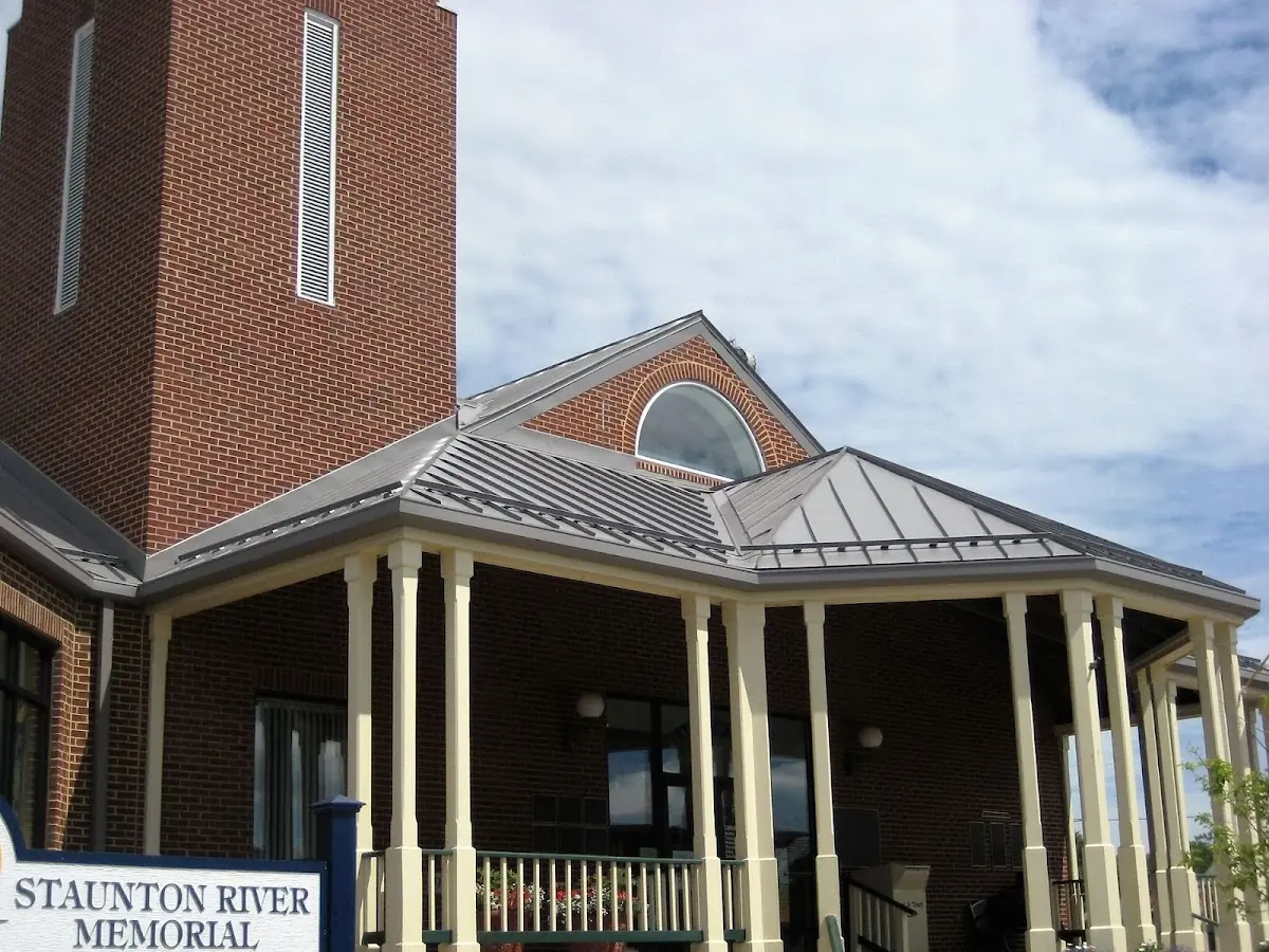 Skilled roofing craftsmen working on a residential roof in Utica